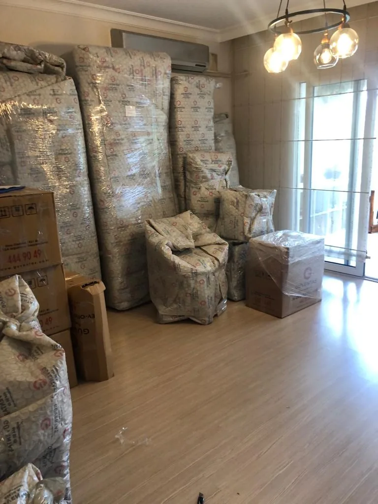Packed household cargo ready for a GüvenExpress move
